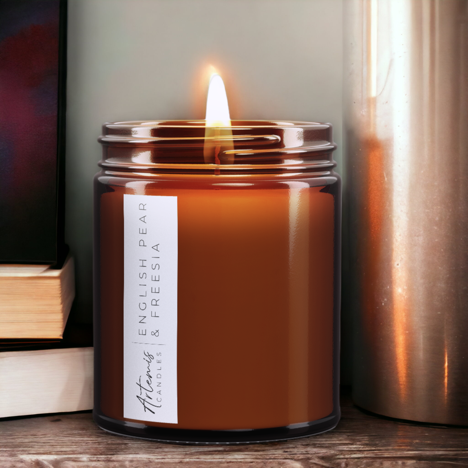 Artemis Candle Company Branded Soy Wax English Pear and Freesia Scented Candle Shown In Amber Glass Jar