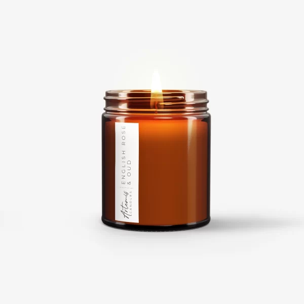 Artemis Candle Company Branded Soy Wax English Oak and Oud Scented Candle Shown In Amber Glass Jar