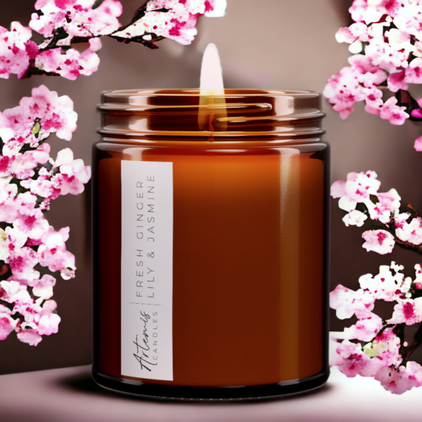 Artemis Candle Company Branded Soy Wax Fresh Ginger Lily and Jasmine Scented Candle Shown In Amber Glass Jar