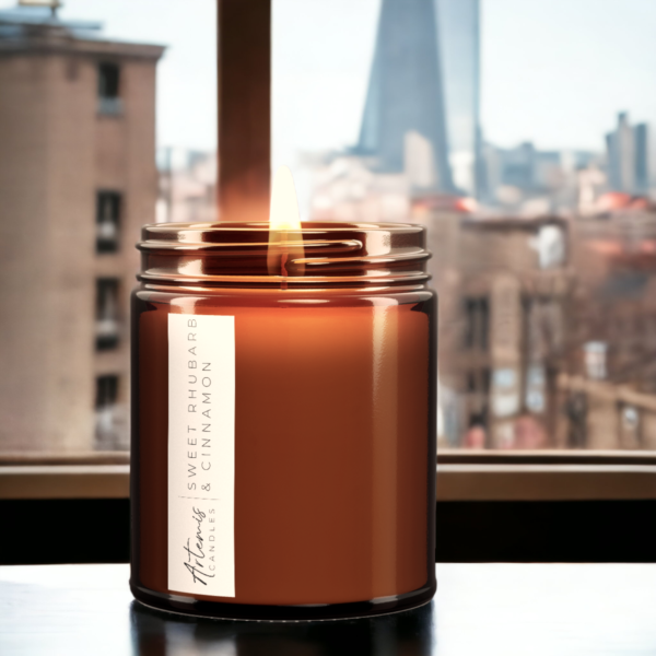 Artemis Candle Company Branded Soy Wax Sweet Rhubarb and Cinnamon Scented Candle Shown In Amber Glass Jar